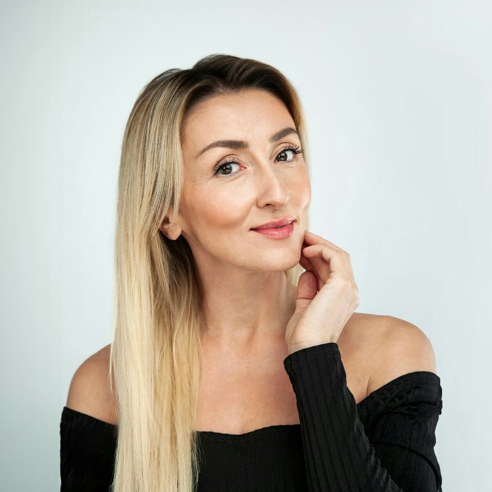 Smiling woman after DiamondGlow treatment