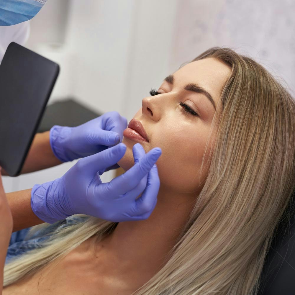 Woman receiving touch-up treatment