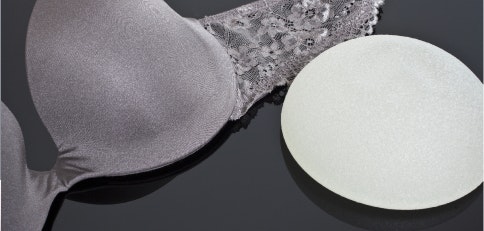 Breast implant next to a bra