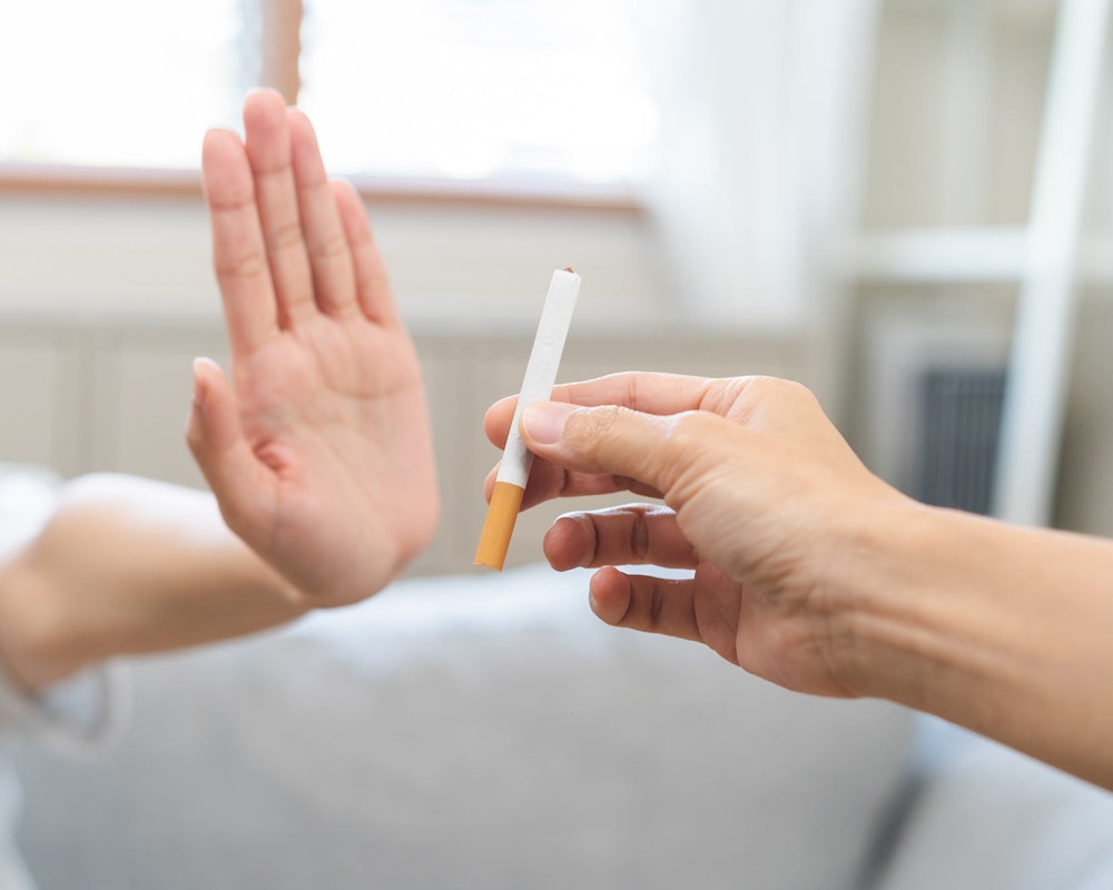 person refusing a cigarette