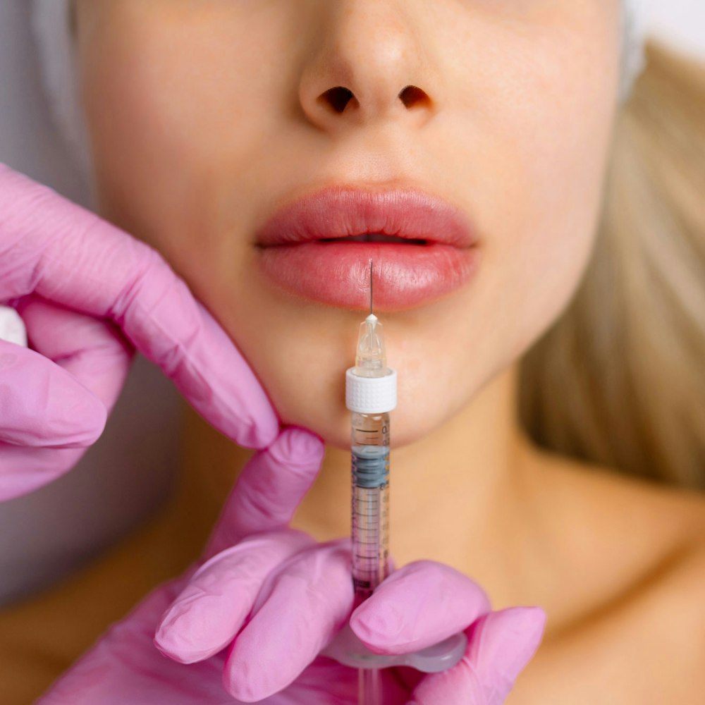Woman getting lip injections