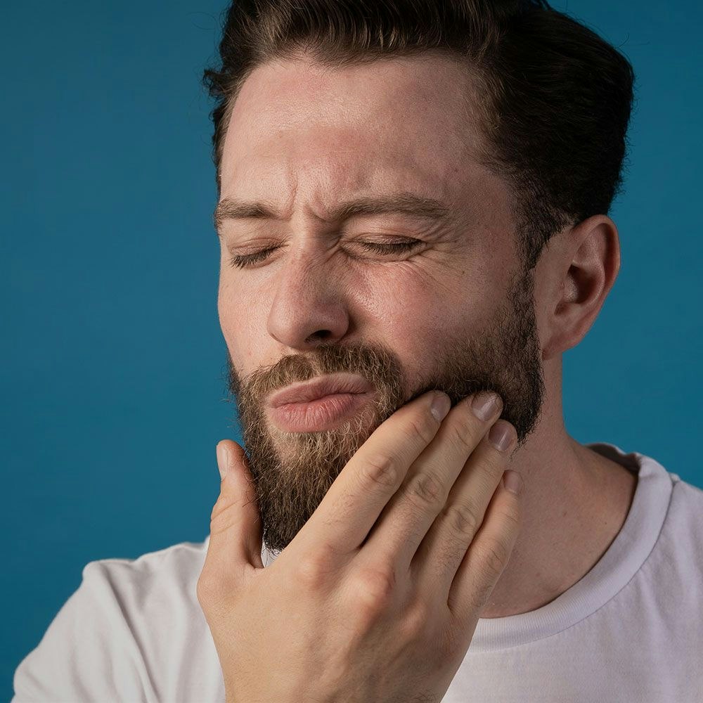A man experiencing tooth pain