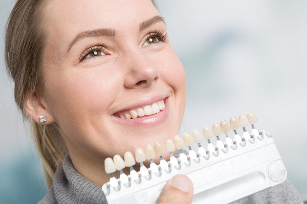 Woman viewing veneers options