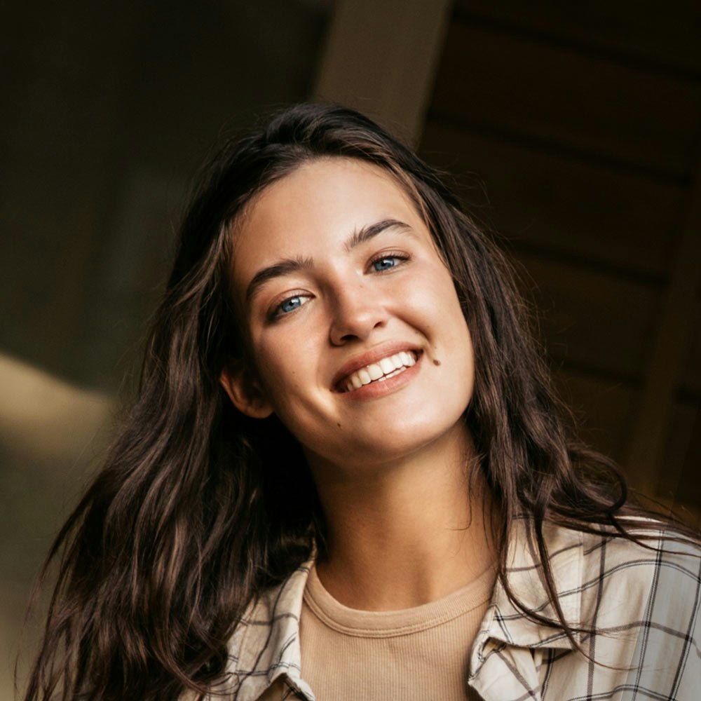 Smiling woman after cosmetic dentistry