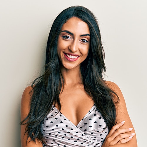 smiling woman in dress showing cleavage