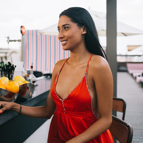 woman wearing red eveningwear