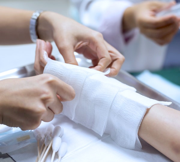 bandaged arm after tattoo removal