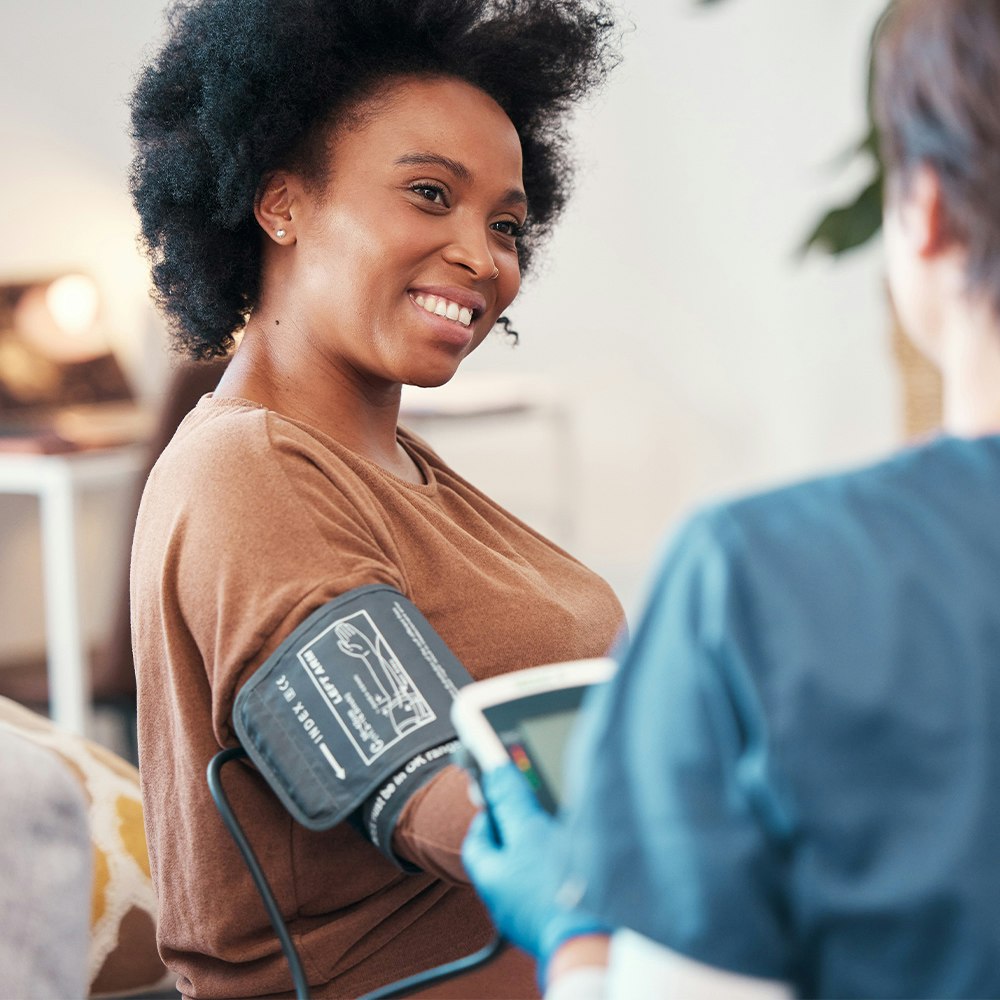 a woman getting her blood pressure checked