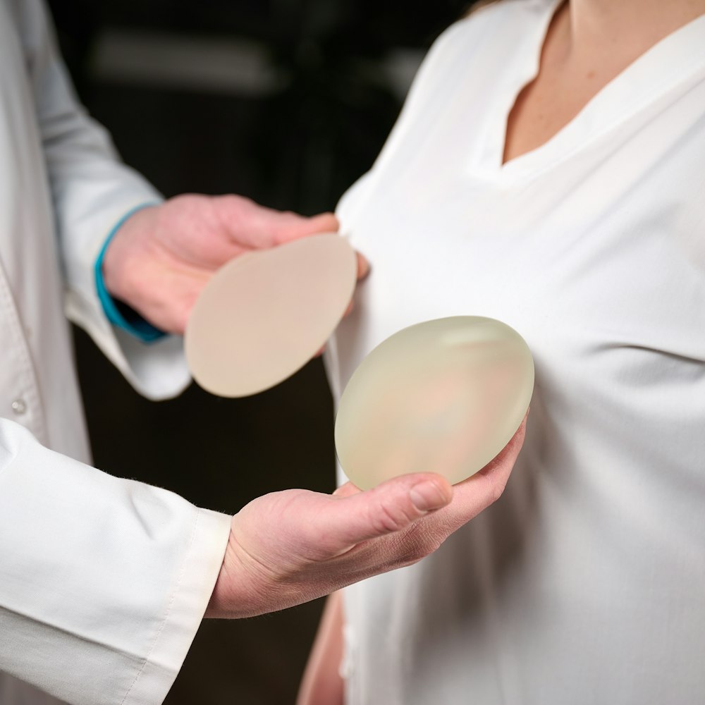 Doctor showing patient implants