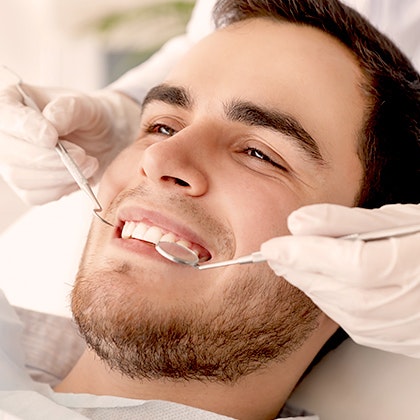 man undergoing dental examination