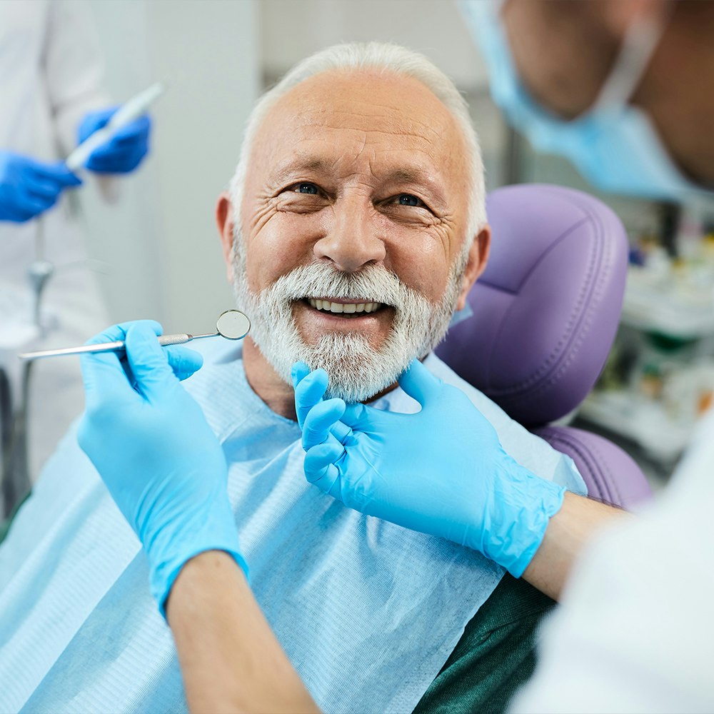 an mature man visiting the dentist