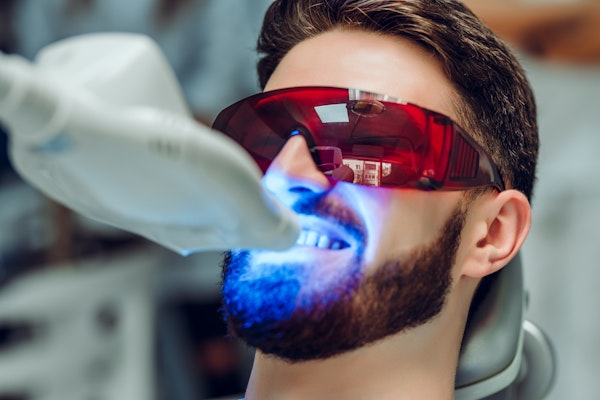 Man getting his teeth professionally whitened