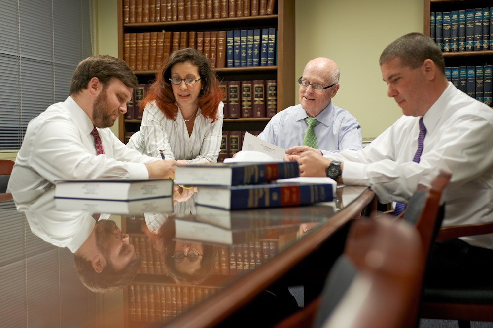 Doctors and lawyers around a table