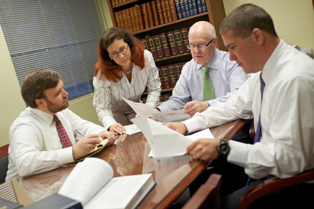 Foley law group having a discussion