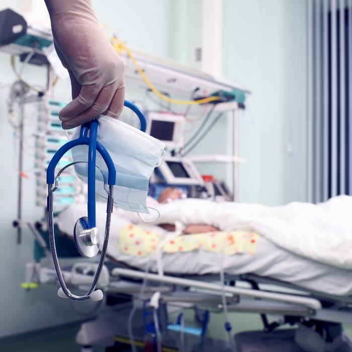 hand holding a stethoscope