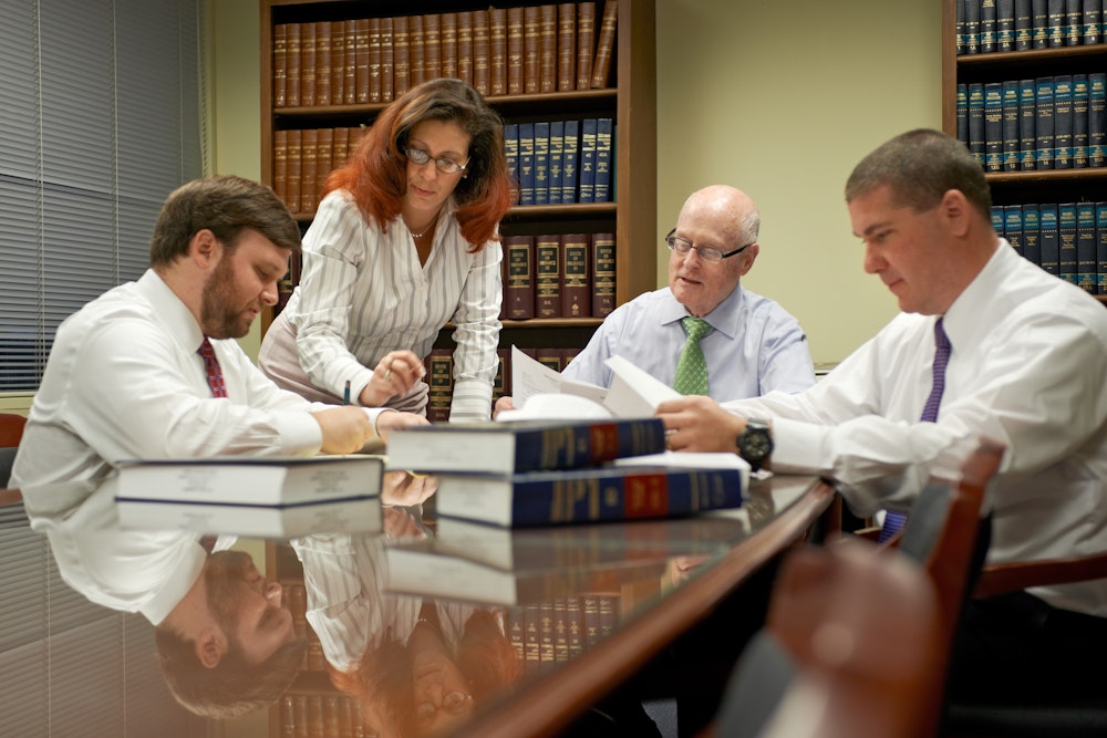 Foley Law team consulting