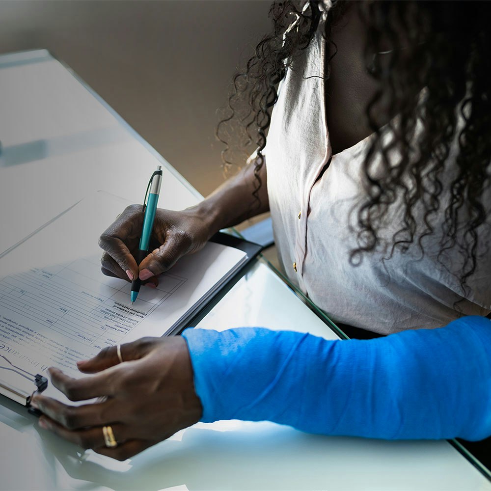 Injured employee filling out paperwork