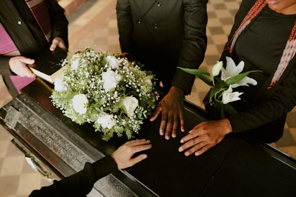 Close-up of hand on a casket