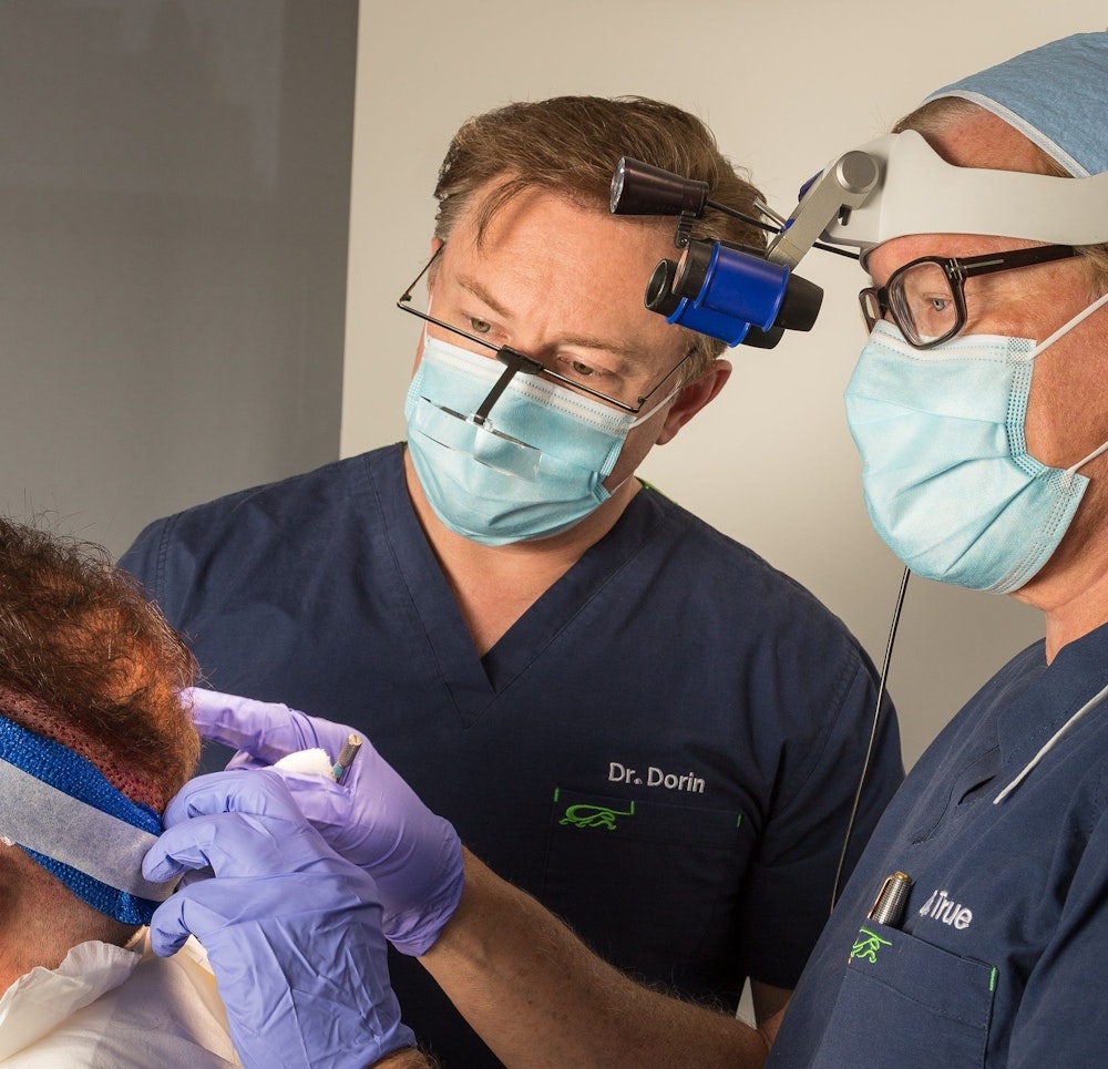 Dr. Robert J. Dorin with other doctor and patient