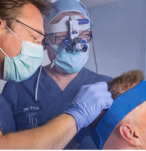 Our surgeons performing a hair transplant