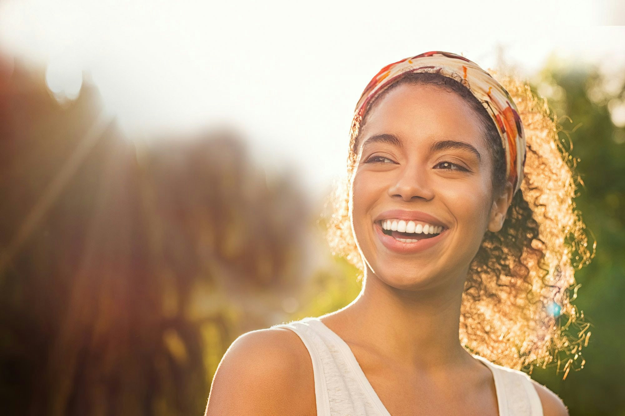 Smiling woman with hair pulled up