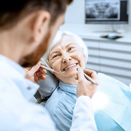 elderly woman in dentist's chair