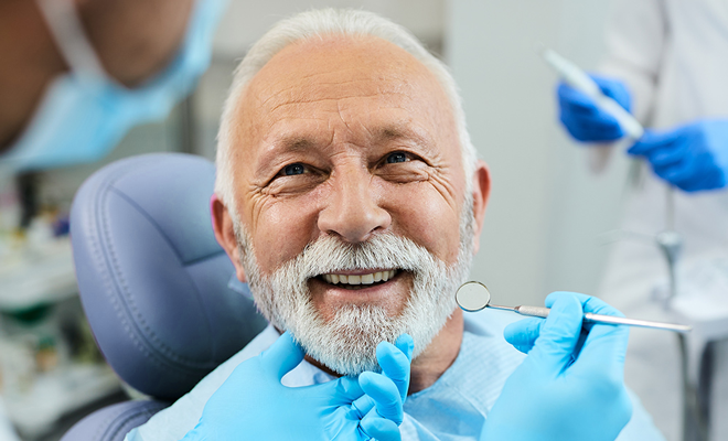 Older man receiving dental care