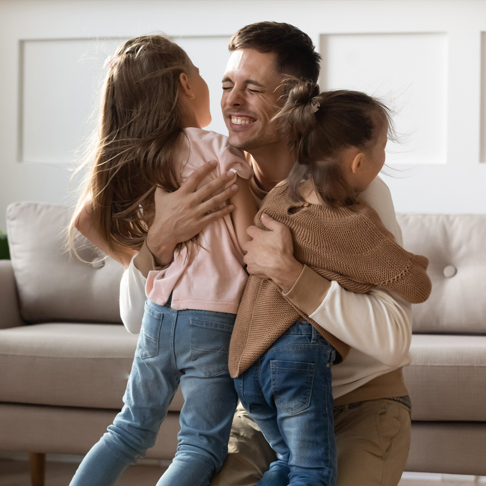 dad hugging children