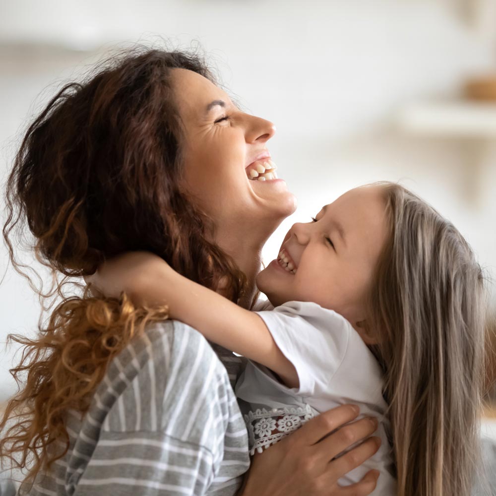 mother hugging child