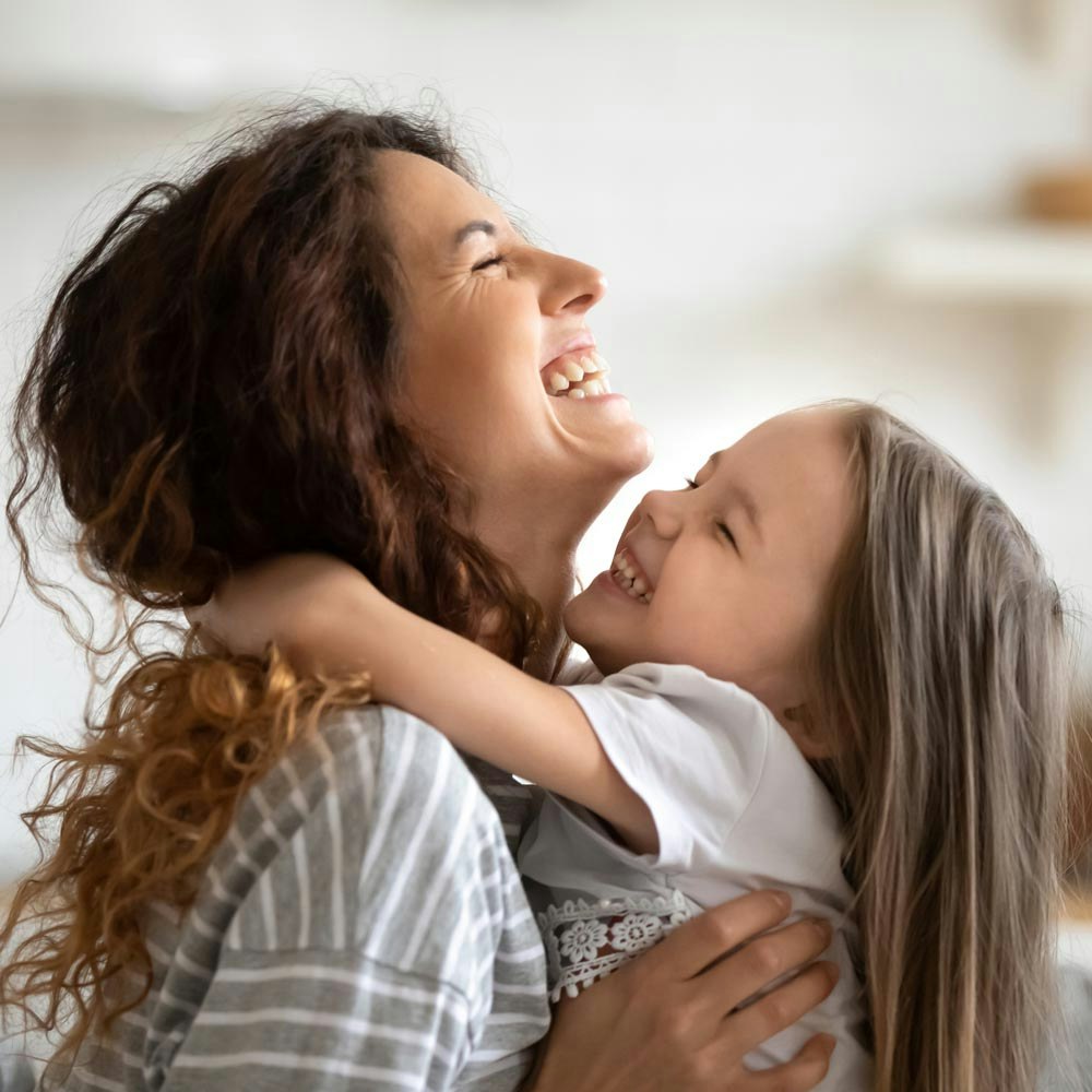 mother hugging child