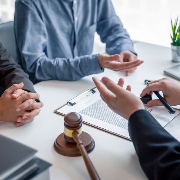 A person meeting with an attorney