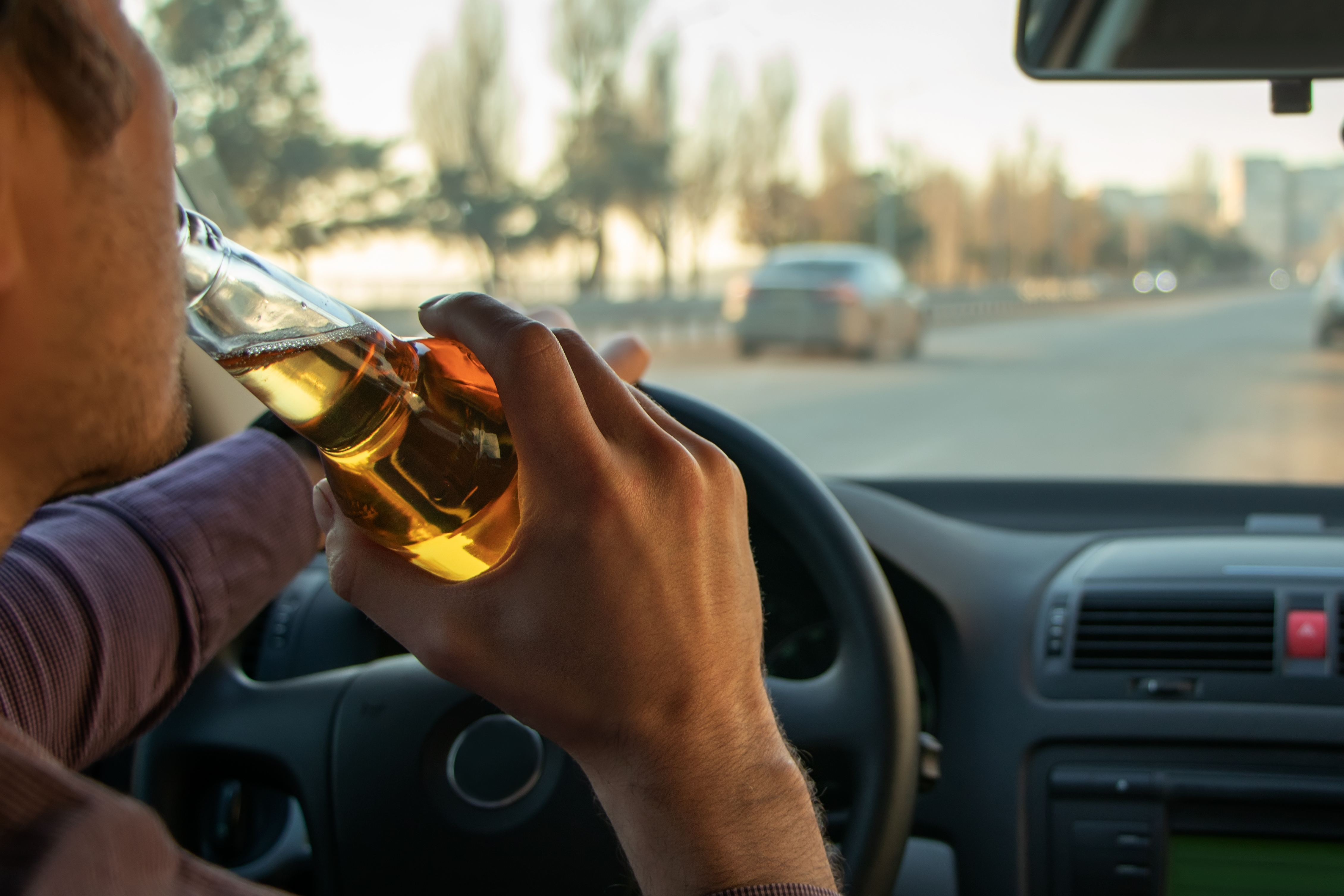 Man drinking while driving
