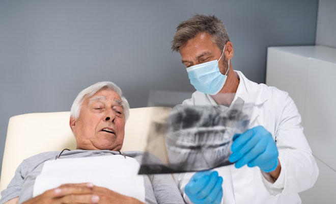 Doctor showing patient x-ray