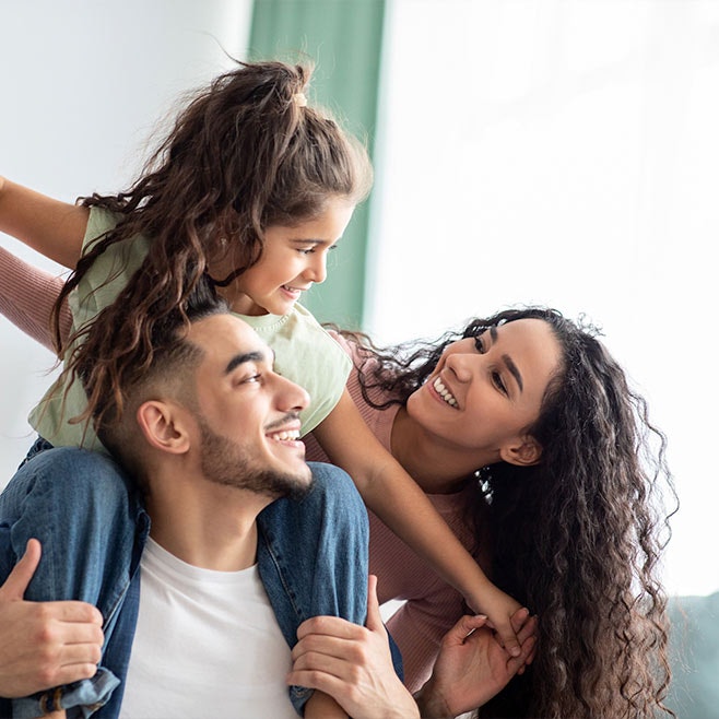 Family smiling at each other