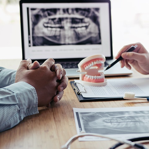 Patient and dentist discussing restoration