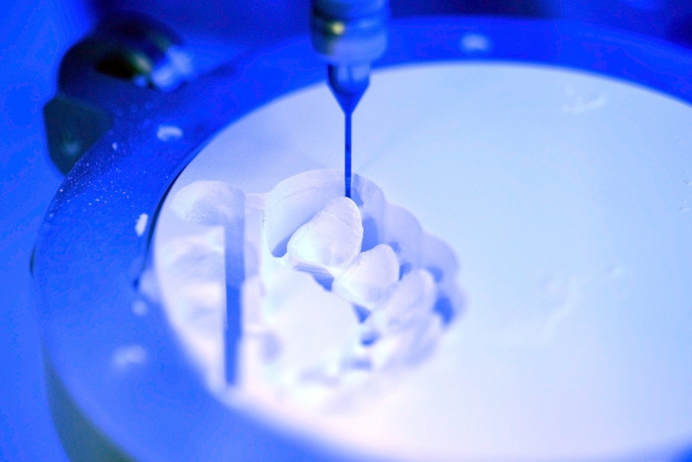 CEREC machine milling a restoration