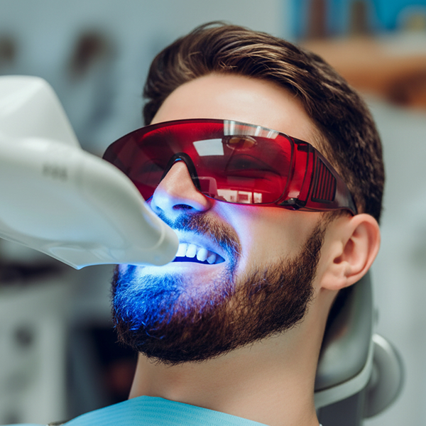 Man getting his teeth professionally whitened