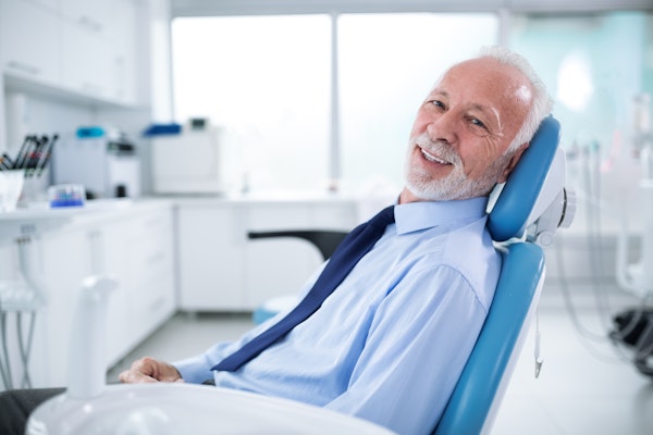 Elderly man in dental chair