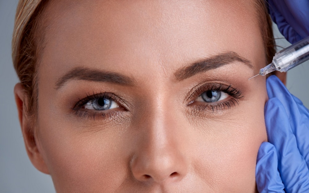 Woman receives cosmetic injections