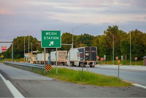 trucks in line at a weigh station