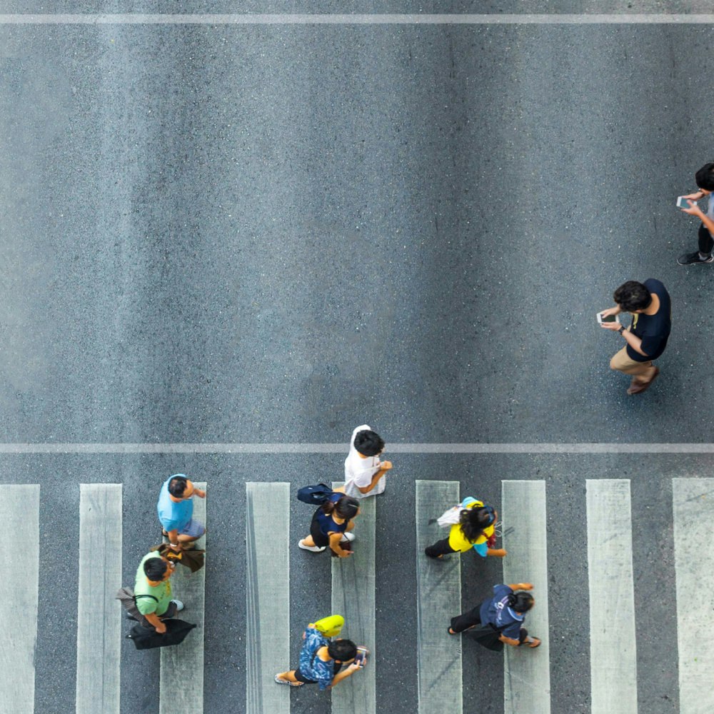 birds eye view of people crossing the street