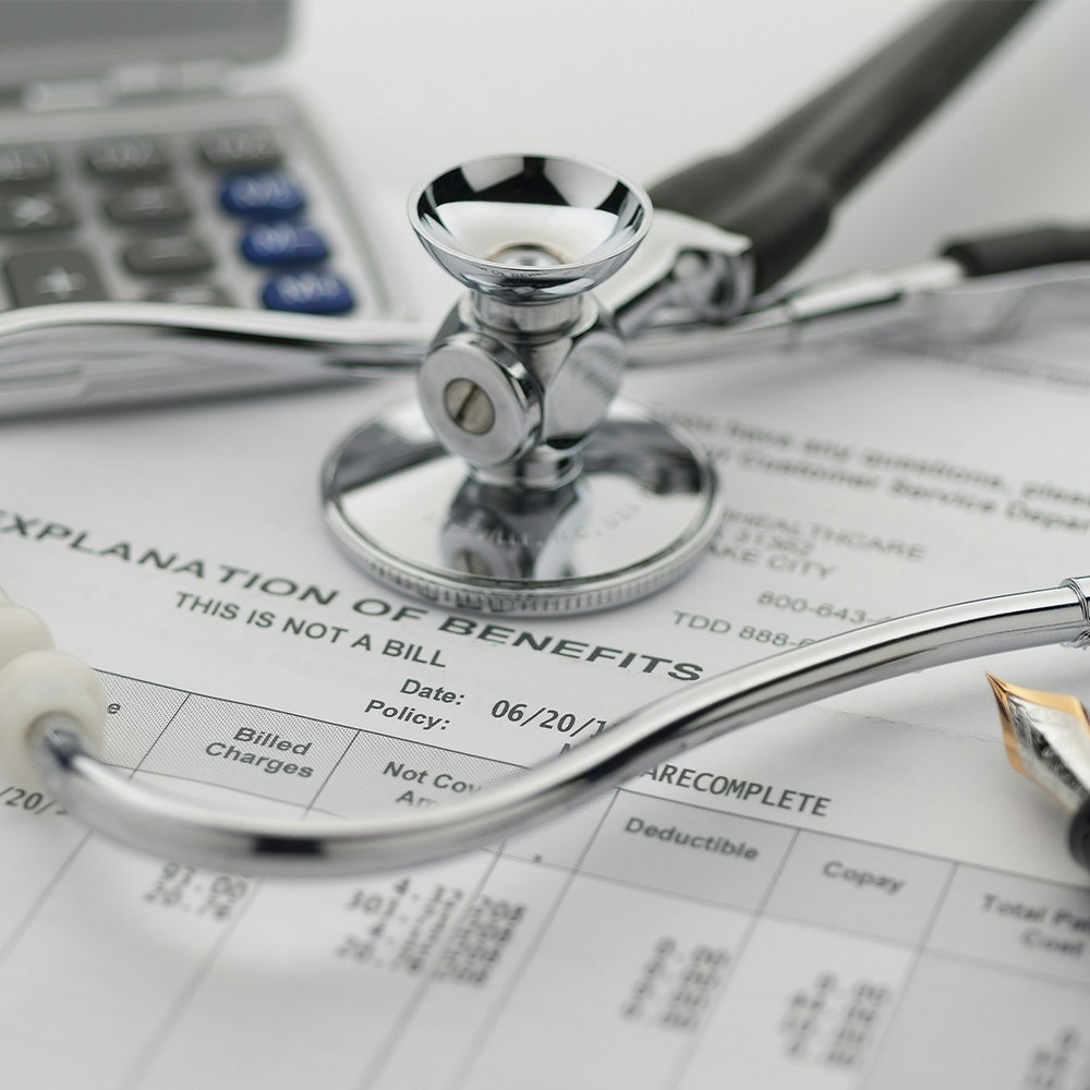 stethoscope on a pile of paperwork