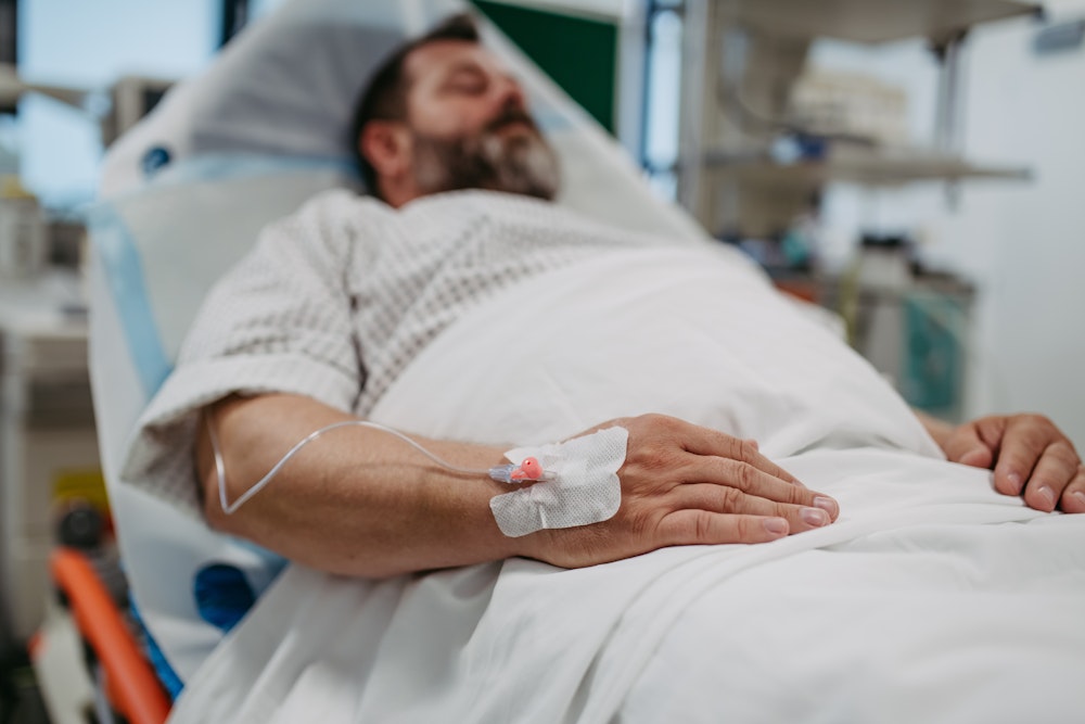 Man in hospital bed