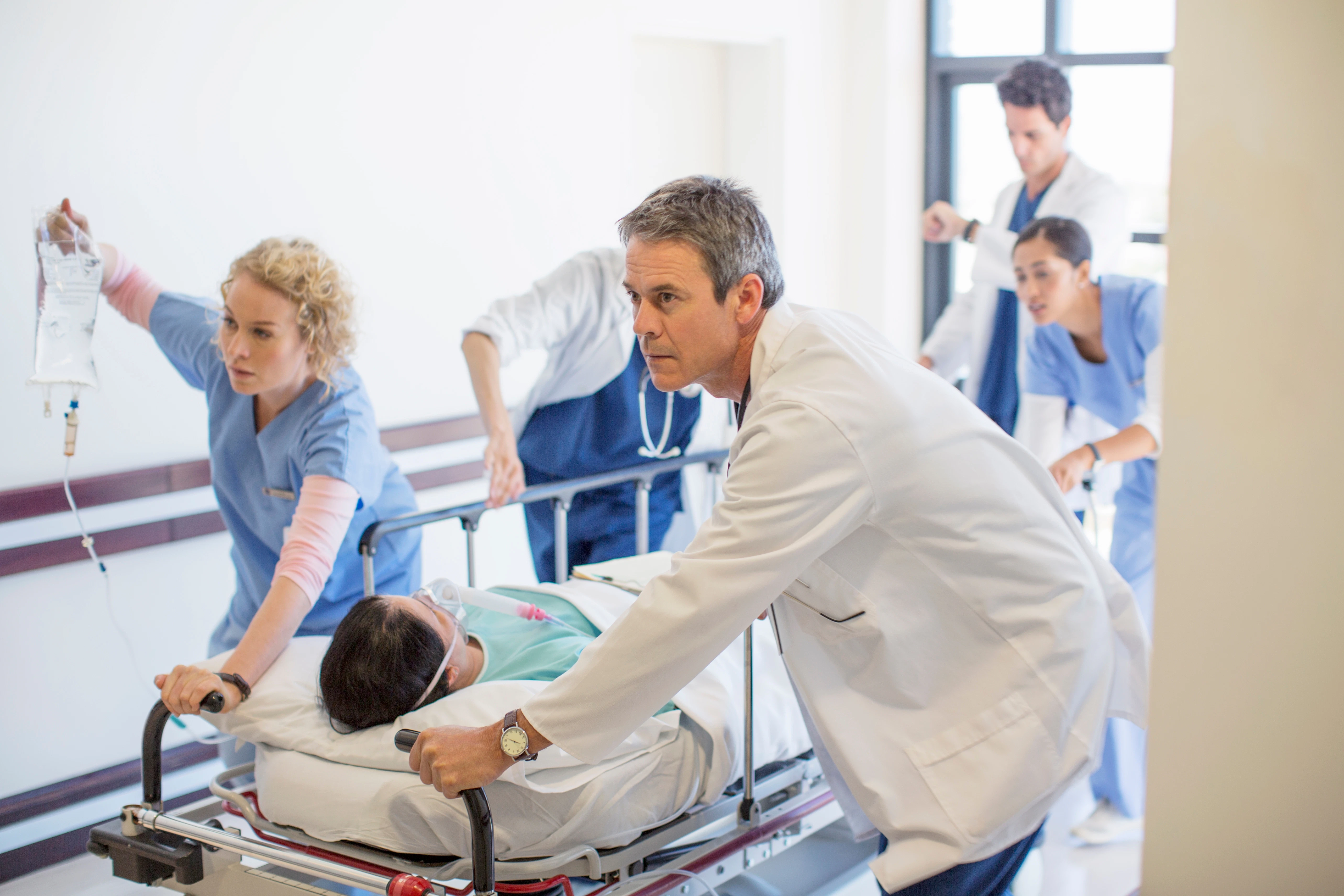 Medical staff with patient on a gurney