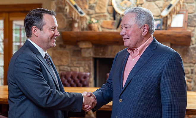 Rocky shaking hands with another lawyer