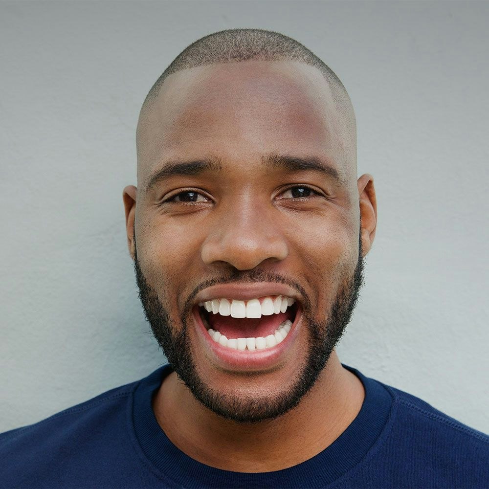 man smiling widely