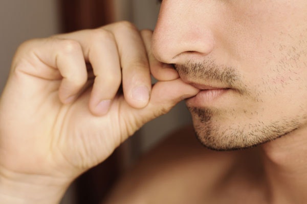 Man biting his nails