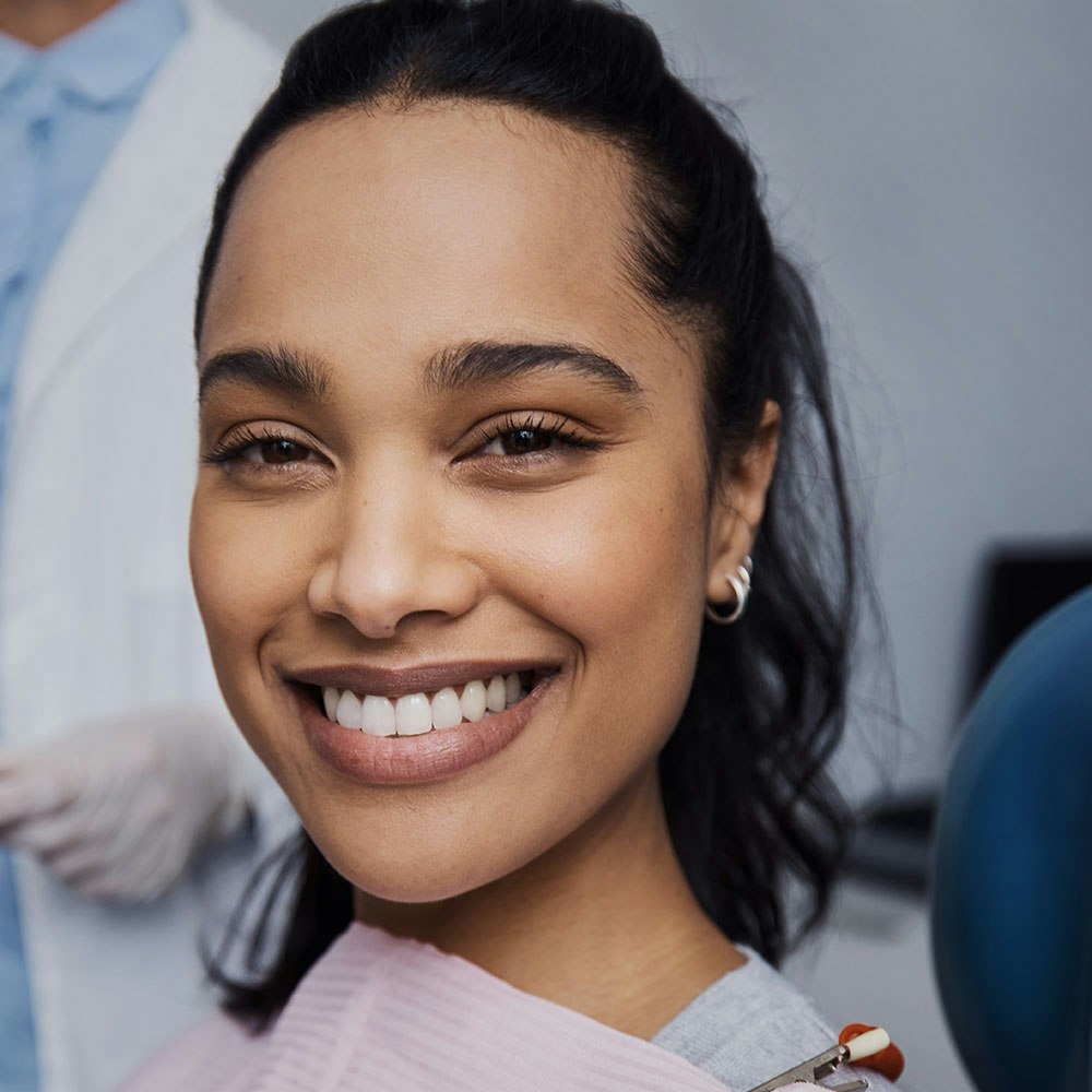 Porcelain veneer being placed on tooth