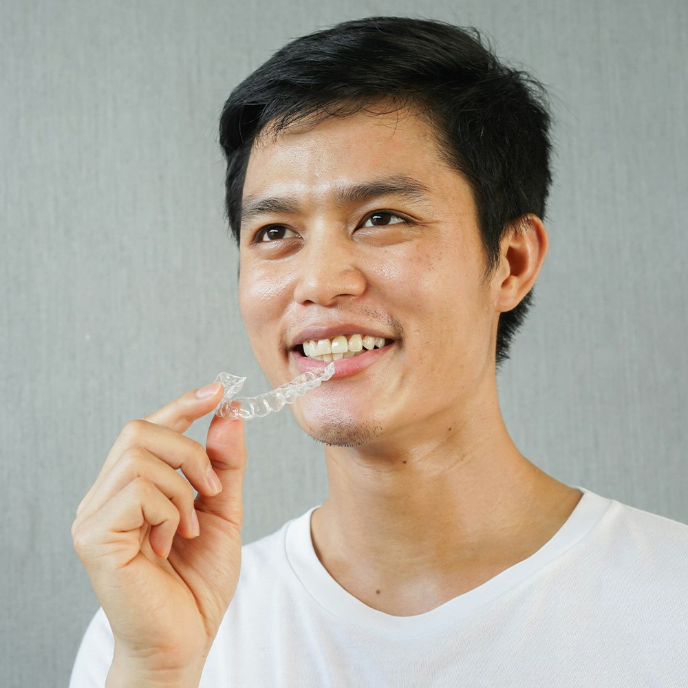 Smiling Man with Invisalign