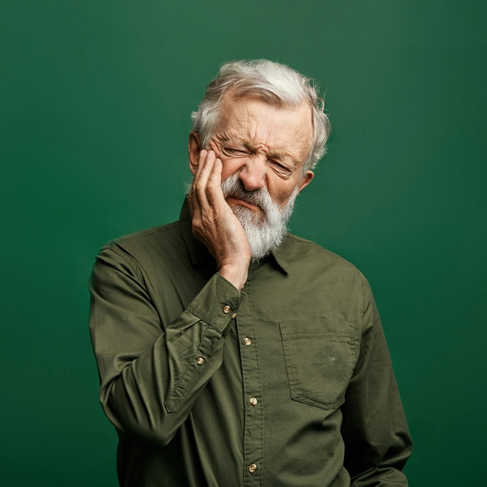 Man with tooth pain, in need of a root canal